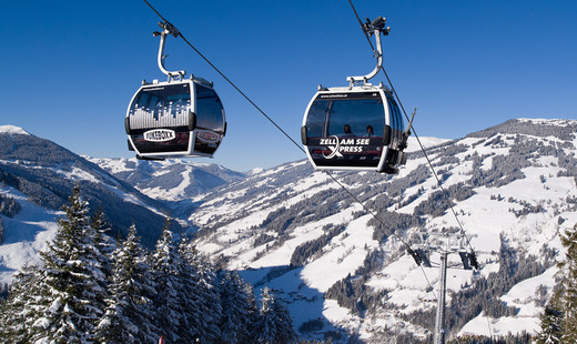 Snowy mountains with ski liftss