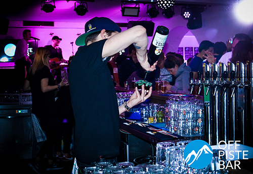 Bartender pouring shots in glasses